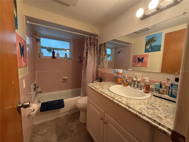 full bathroom with tile patterned flooring, vanity, toilet, and shower / tub combo with curtain