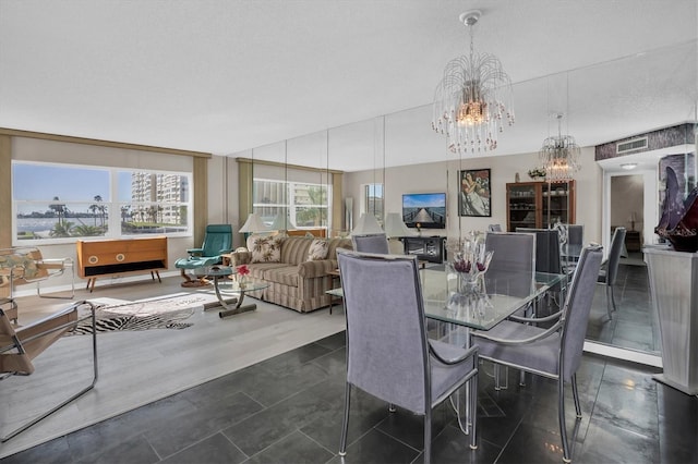 4575 Cove Cir Unit 202, Saint Petersburg, FL 33708 - dining room featuring a chandelier