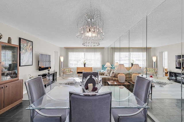 4575 Cove Cir Unit 202, Saint Petersburg, FL 33708 - dining area with a textured ceiling and a chandelier