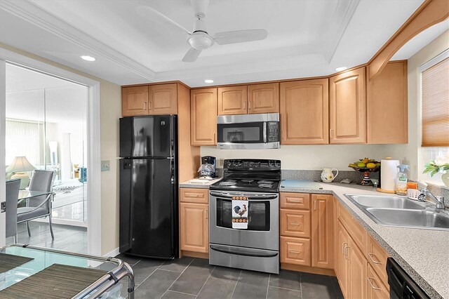 kitchen with ceiling fan, sink, a raised ceiling, black appliances, and dark tile patterned flooring