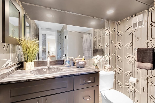 4575 Cove Cir Unit 202, Saint Petersburg, FL 33708 - full bathroom featuring vanity, toilet, and recessed lighting
