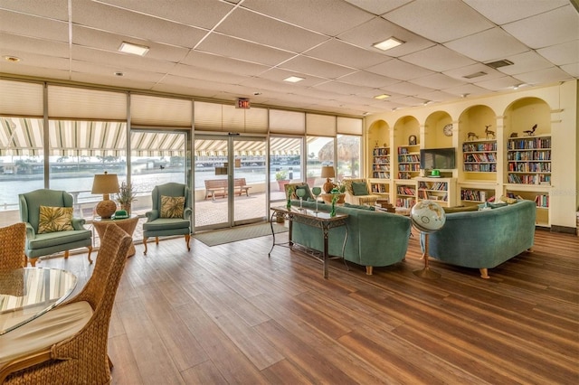 4575 Cove Cir Unit 202, Saint Petersburg, FL 33708 - living room featuring a paneled ceiling and wood finished floors