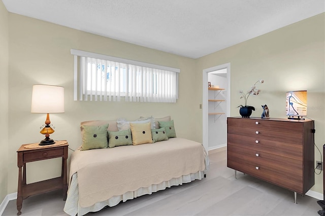 4575 Cove Cir Unit 202, Saint Petersburg, FL 33708 - bedroom featuring baseboards and a spacious closet