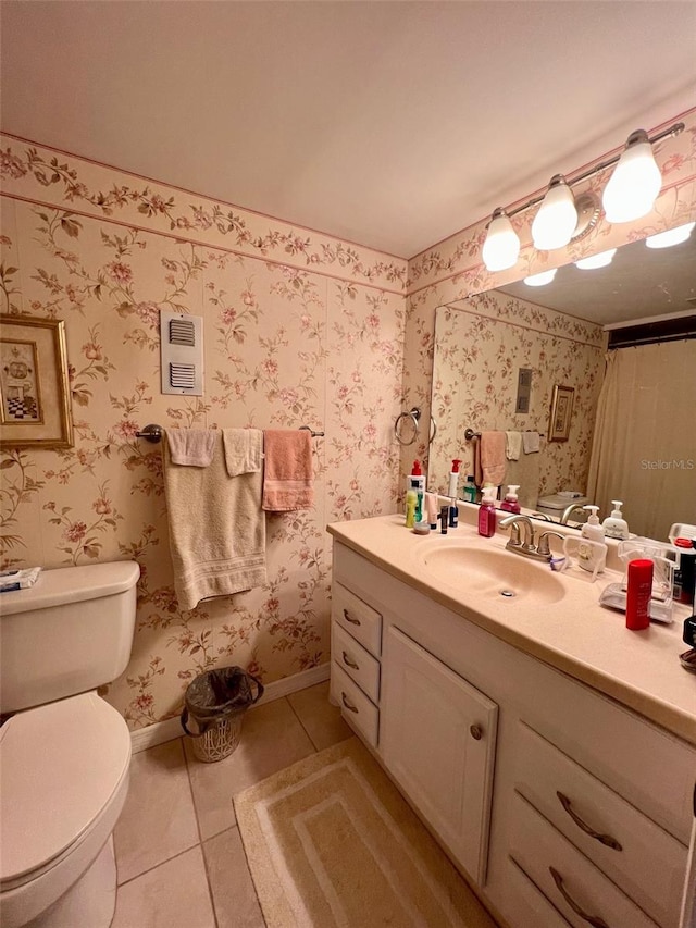 bathroom with tile patterned floors, vanity, a shower with shower curtain, and toilet