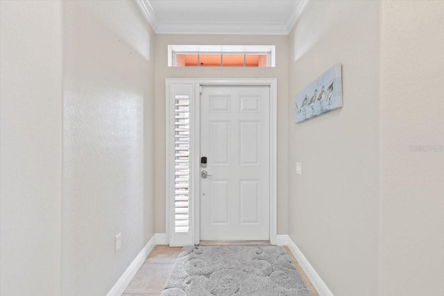 foyer with light tile patterned floors and ornamental molding