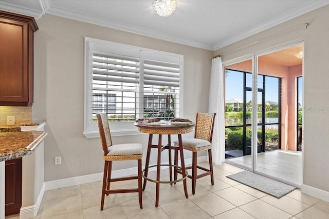 tiled dining room with crown molding