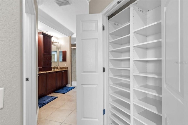 bathroom featuring tile patterned floors and vanity