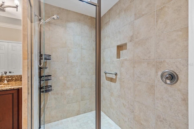 bathroom featuring vanity and tiled shower