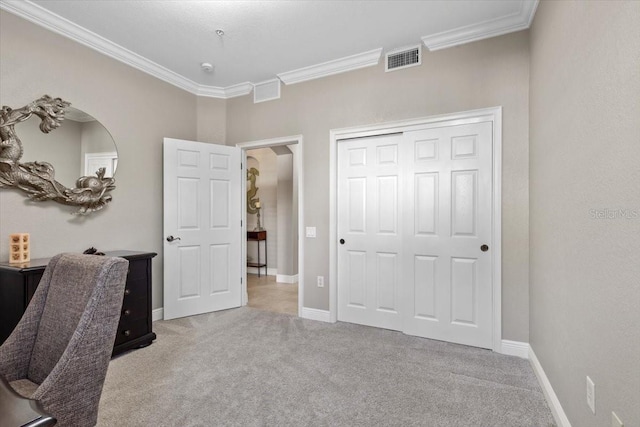 carpeted home office featuring crown molding