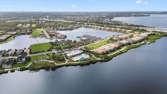 birds eye view of property with a water view