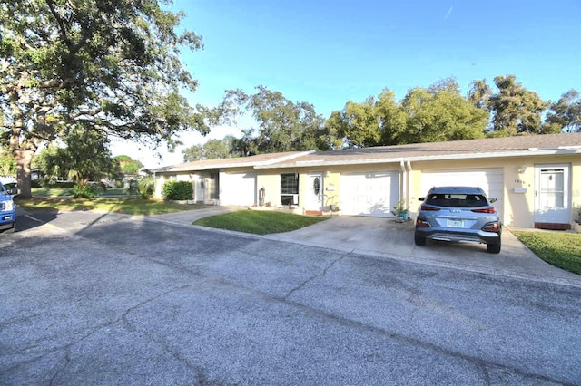 ranch-style house featuring a garage