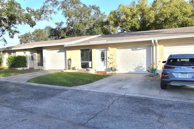 ranch-style home featuring a garage