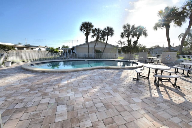 view of swimming pool featuring a patio area