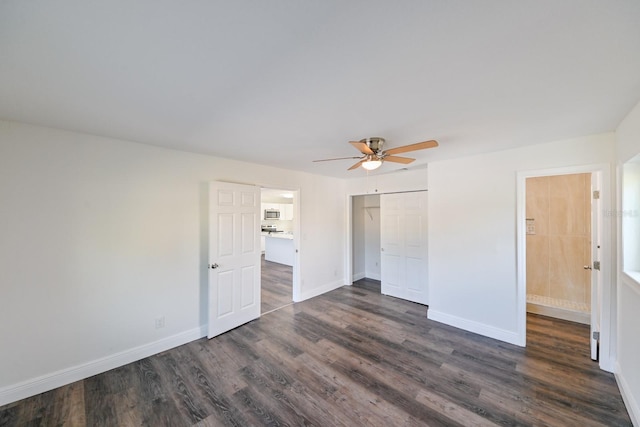 unfurnished bedroom with a closet, ceiling fan, and dark hardwood / wood-style flooring