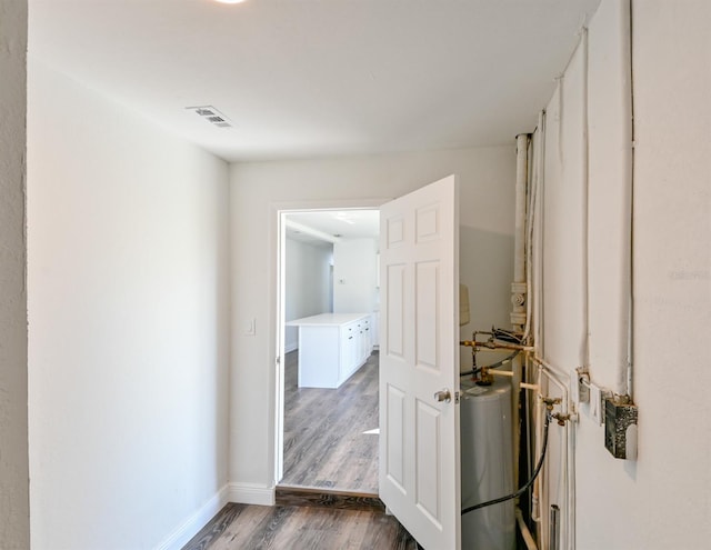 hall with dark wood-type flooring