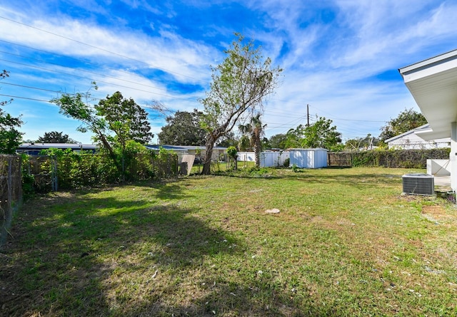 view of yard with central AC unit