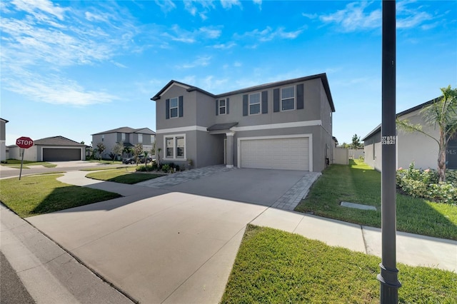 view of front of house featuring a front lawn and a garage