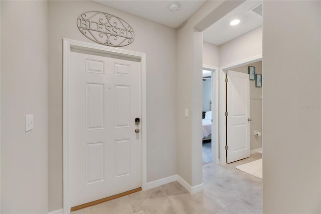 entryway with light tile patterned floors