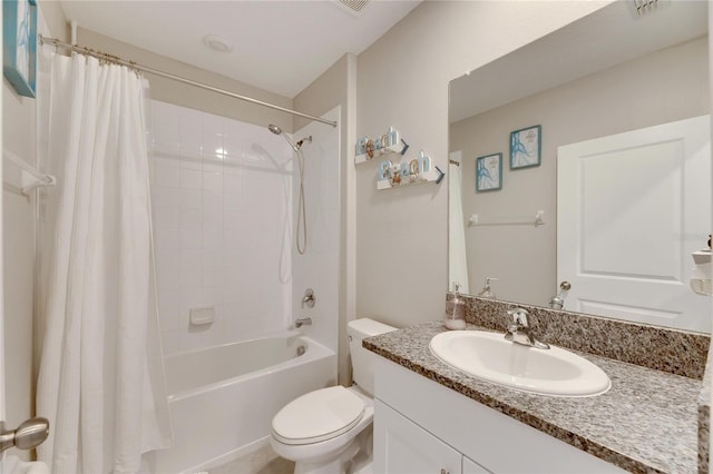 full bathroom featuring shower / bath combo with shower curtain, vanity, and toilet