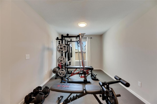 exercise area with a textured ceiling