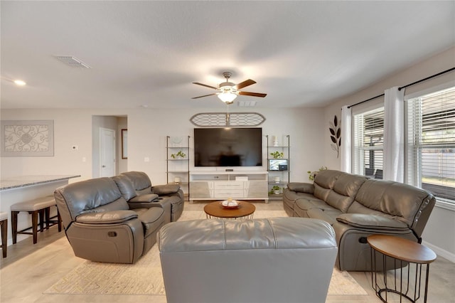 living room featuring ceiling fan