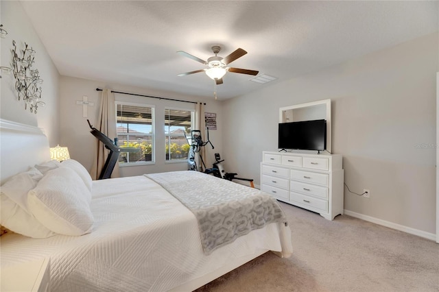 bedroom featuring light carpet and ceiling fan