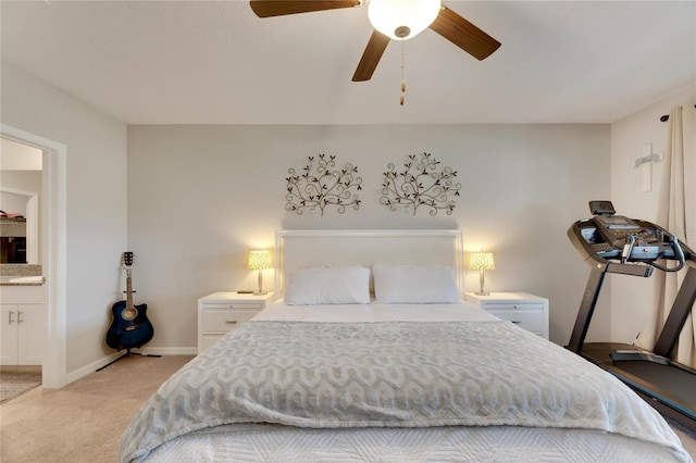 carpeted bedroom featuring ceiling fan and connected bathroom