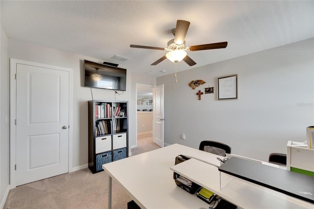 carpeted office with ceiling fan