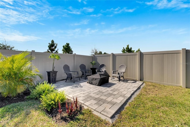 view of patio / terrace featuring an outdoor fire pit