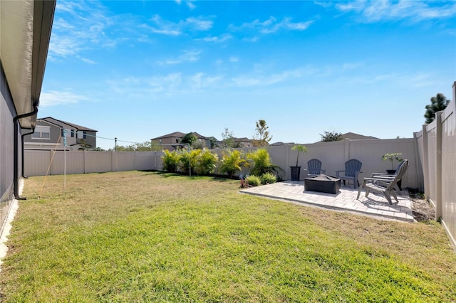 view of yard featuring a patio and a fire pit