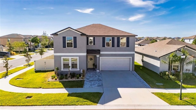 view of front facade with a front lawn and a garage