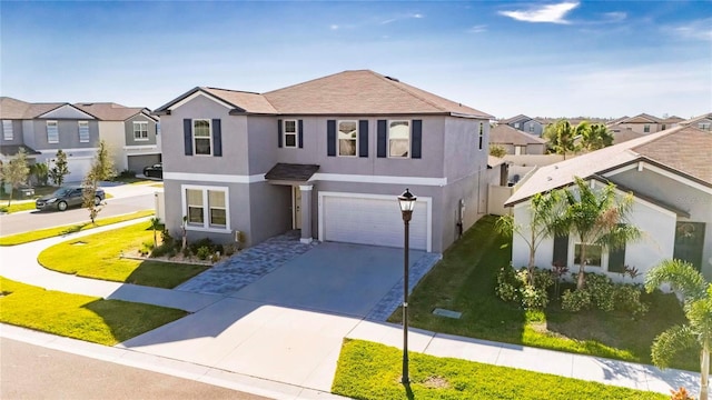 view of front of house with a garage and a front lawn