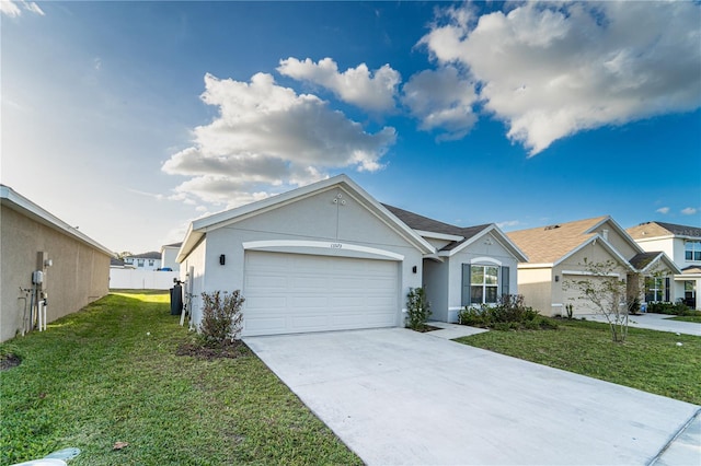 ranch-style home with a front yard and a garage