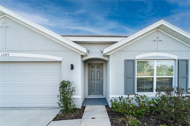 property entrance with a garage