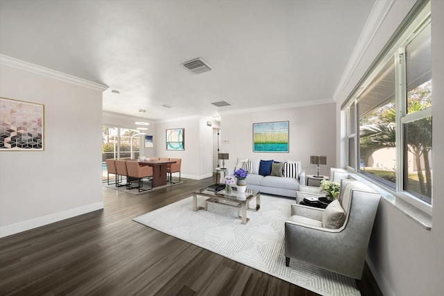 living room with dark hardwood / wood-style flooring and ornamental molding