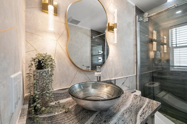 13632 Imperial Groves Dr S, Largo, FL 33774 - bathroom with tile walls and a shower
