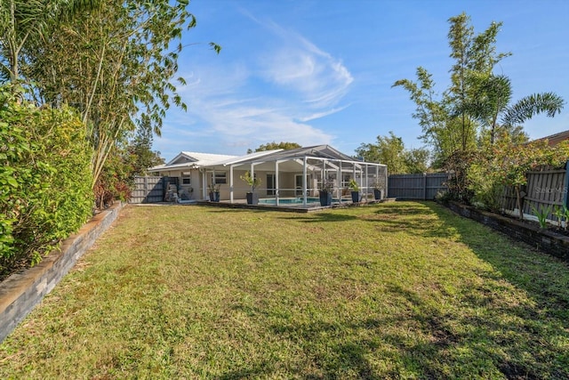 view of yard featuring a lanai and a pool