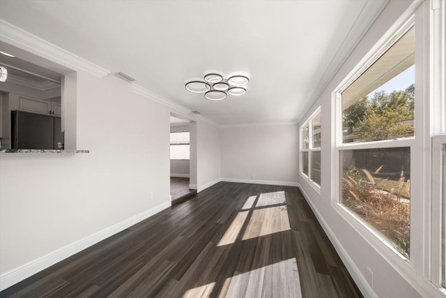 interior space with crown molding and dark wood-type flooring