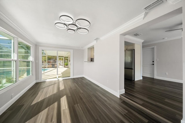 unfurnished living room featuring ceiling fan, crown molding, and dark wood-type flooring