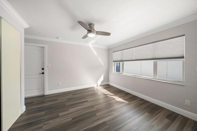 empty room with ceiling fan, dark hardwood / wood-style flooring, and ornamental molding