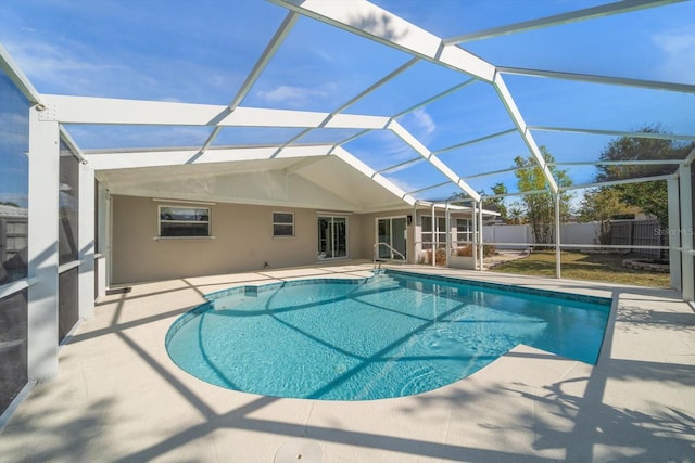 view of pool with a patio area and a lanai