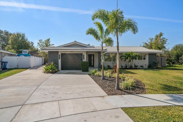 single story home with a front yard and a garage