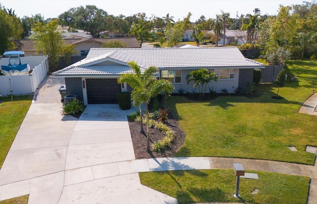 single story home with a garage and a front yard