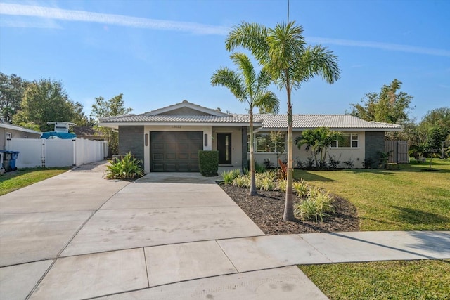 13632 Imperial Groves Dr S, Largo, FL 33774 - single story home featuring a garage, driveway, a gate, a tile roof, and stucco siding