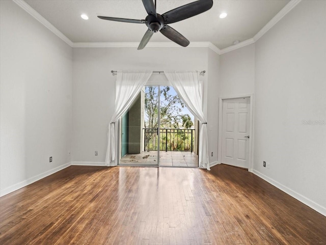 spare room featuring dark hardwood / wood-style floors, ceiling fan, and crown molding