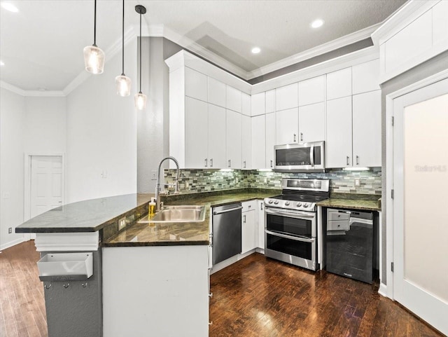 kitchen featuring dark wood-type flooring, sink, white cabinets, and stainless steel appliances