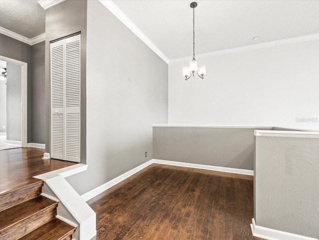 interior space with crown molding, hardwood / wood-style floors, and a chandelier