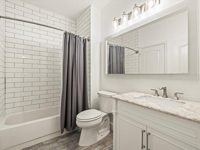 full bathroom featuring wood-type flooring, vanity, shower / tub combo, and toilet