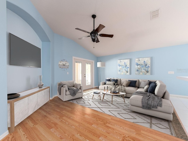 living room featuring french doors, vaulted ceiling, light hardwood / wood-style flooring, and ceiling fan