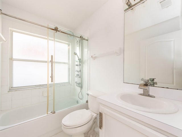 full bathroom with toilet, vanity, and combined bath / shower with glass door